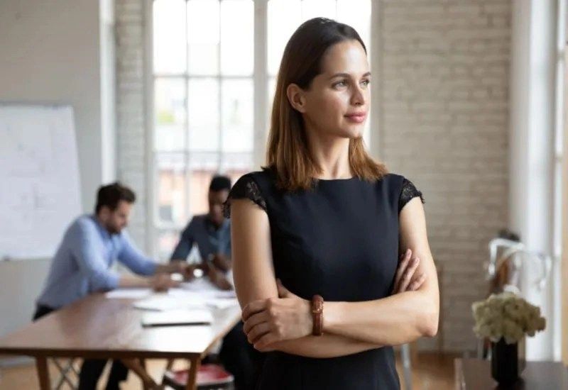 Businesswoman standing arms crossed